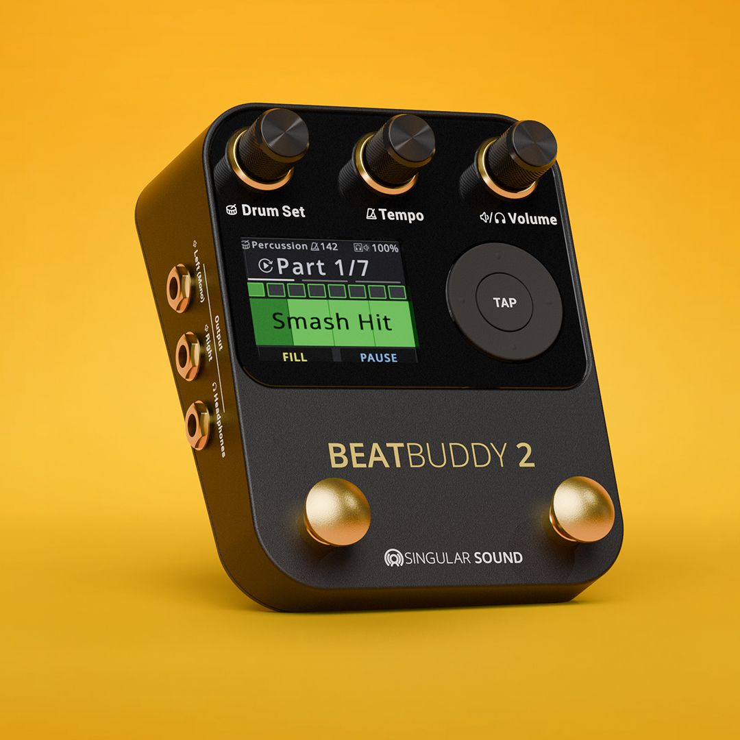 A black BeatBuddy 2 drum machine pedal with three knobs, a small display screen, two footswitches, and input/output jacks, shown on a bright yellow background.