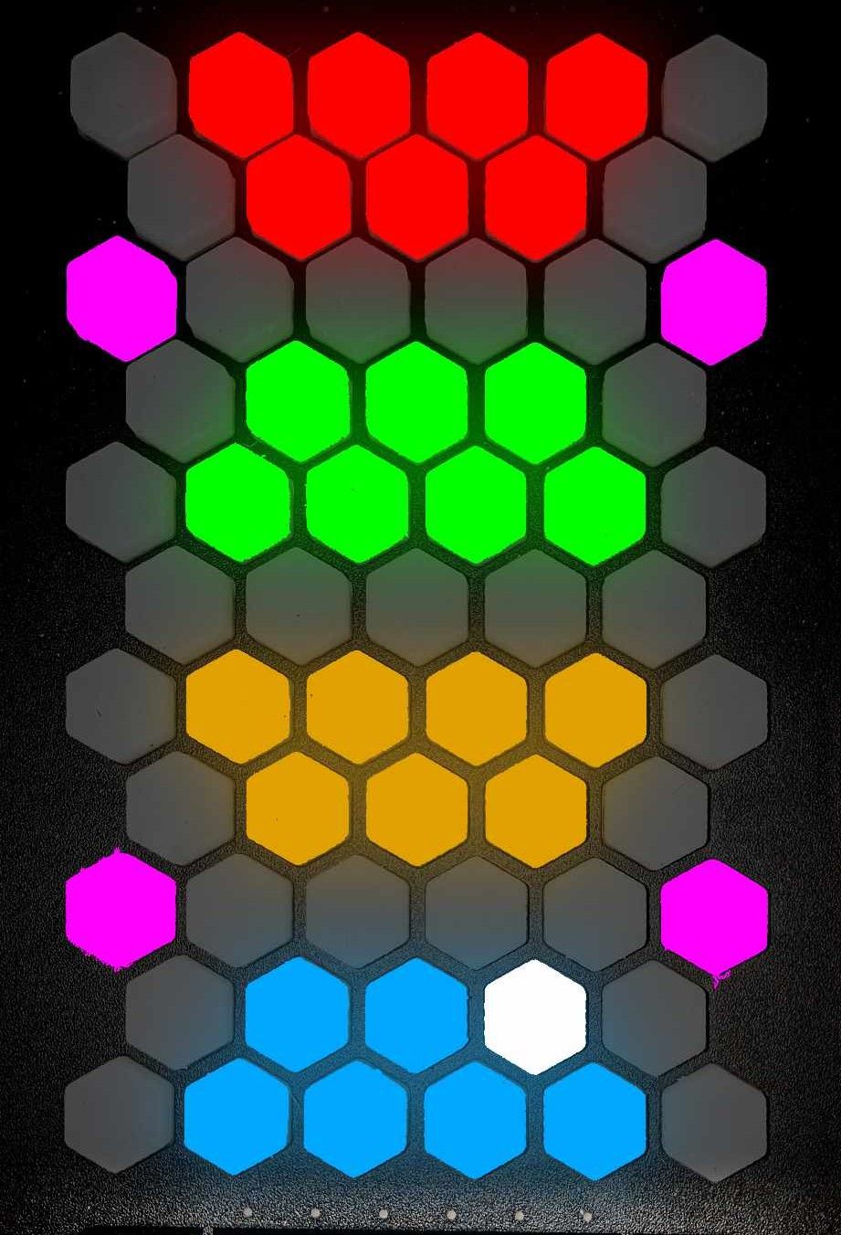 A grid of hexagonal buttons, mostly gray, with colored clusters: red at the top, green, yellow, and blue in the middle, pink on the sides, and one white hexagon near the bottom.