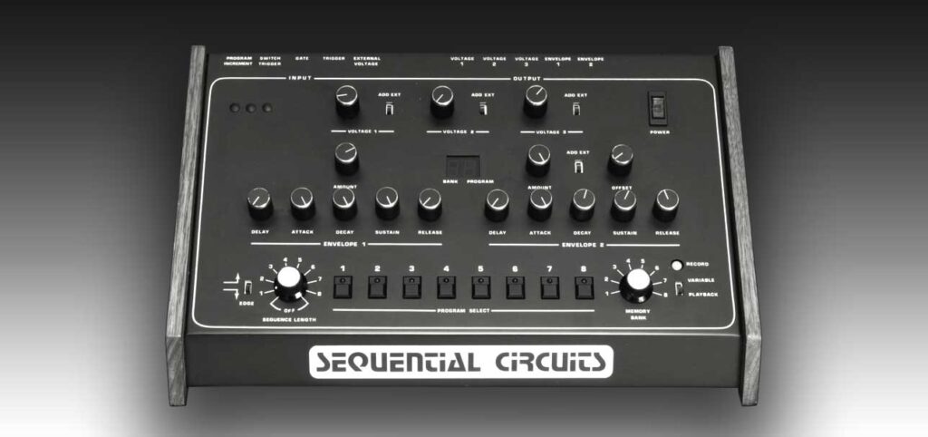 A vintage Sequential Circuits synthesizer with multiple knobs, switches, and buttons on a black panel, displayed against a gradient gray background. The brand name “Sequential Circuits” is printed at the front.
