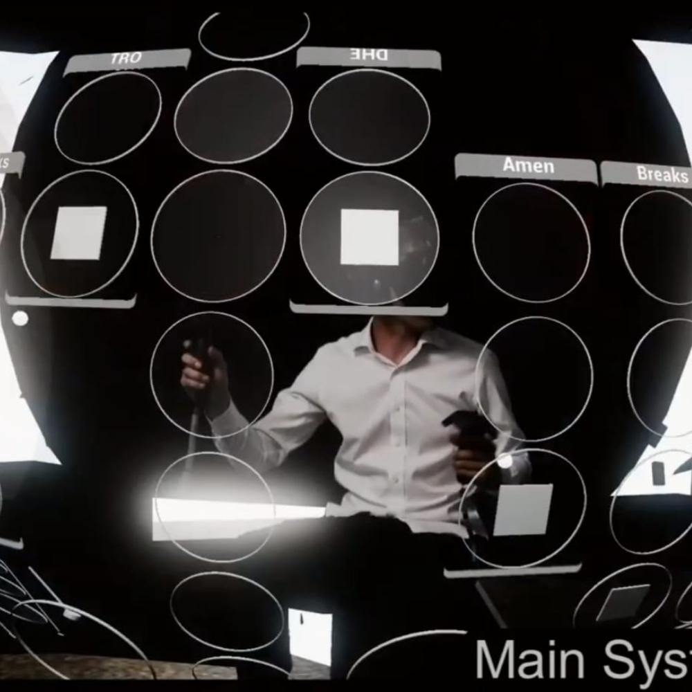 A person in a white shirt sits holding VR controllers, surrounded by a virtual interface with circular and square icons. The interface displays labels like DHE, Amen, and Breaks. The text Main Sys is partially visible at the bottom.