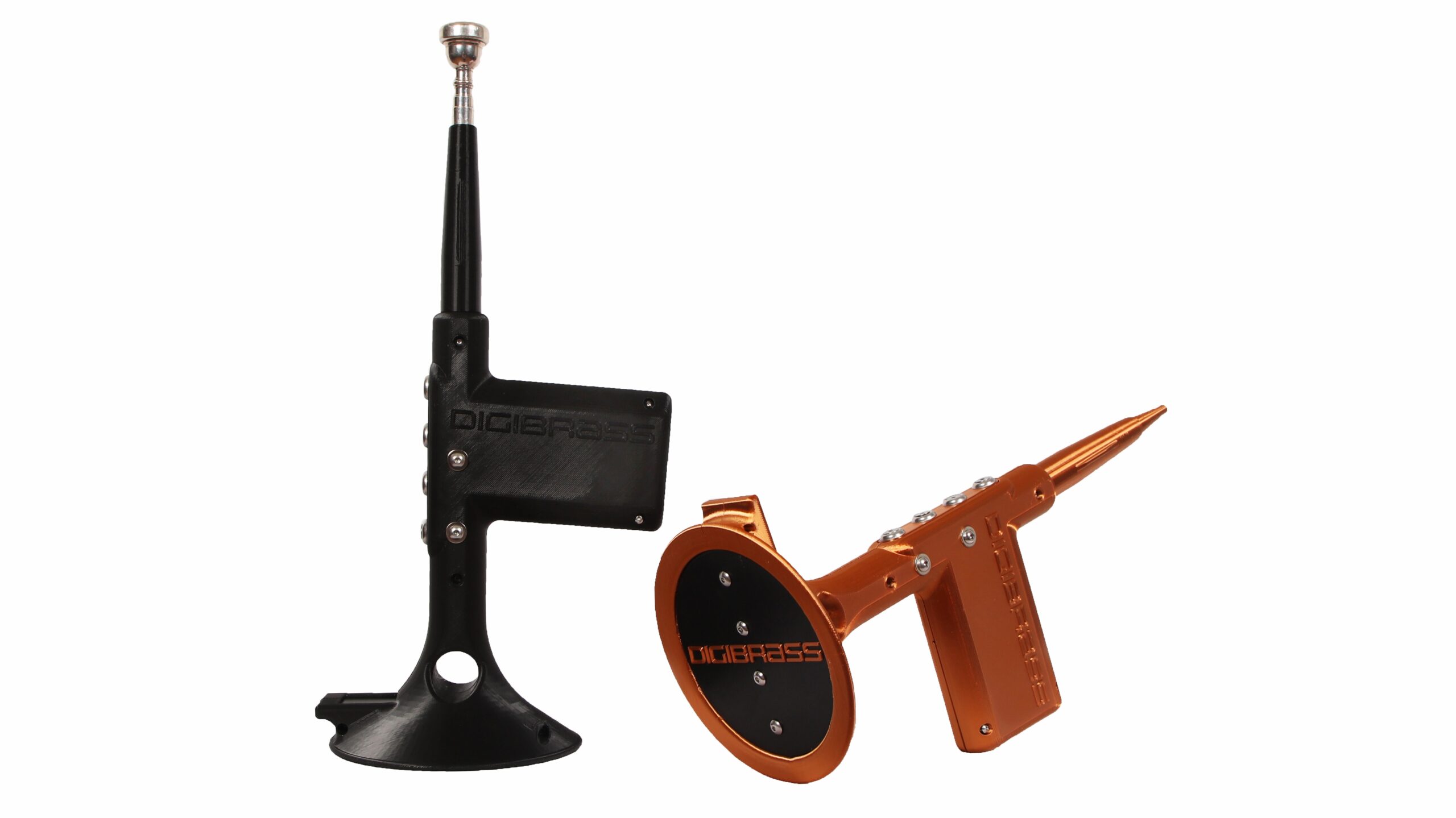 Two electronic brass instrument practice devices, one black and standing upright, the other orange and lying horizontally, both labeled “DIGIBRASS.”.