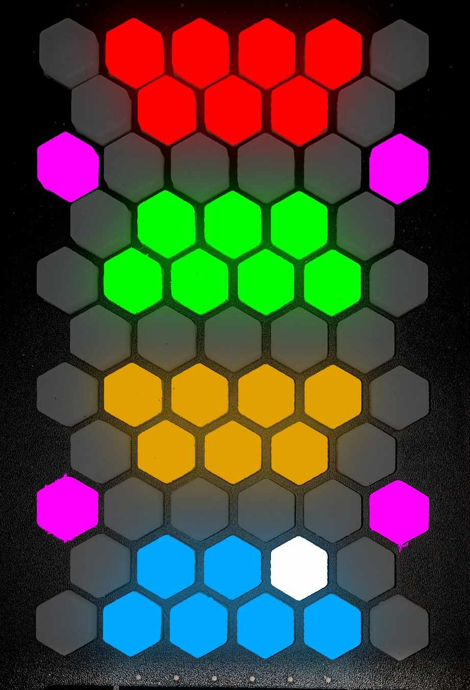 A grid of hexagonal buttons, mostly gray, with colored clusters: red at the top, green, yellow, and blue in the middle, pink on the sides, and one white hexagon near the bottom.