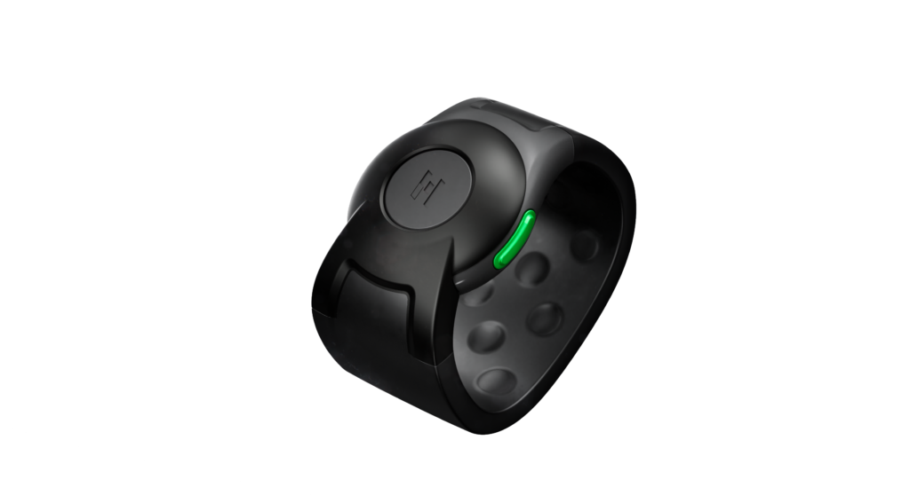 A sleek black wearable wristband with a round face, featuring a single green indicator light on the side, displayed against a plain white background.