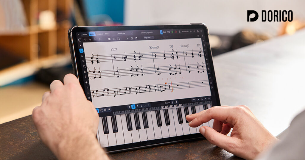A person uses a tablet displaying music notation software and a virtual piano keyboard. The Dorico logo is visible in the top right corner.