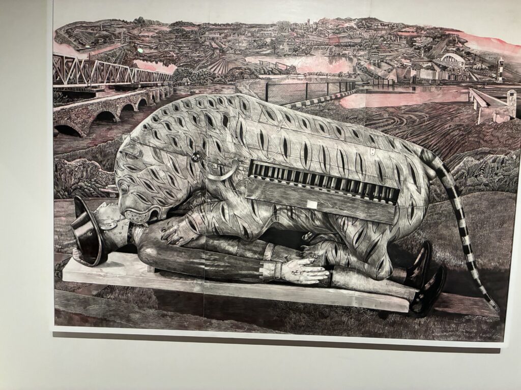 A large, mechanical, creature lies on top of a reclining human figure in a suit, set against a detailed, monochrome cityscape with bridges, buildings, and fields in the background.
