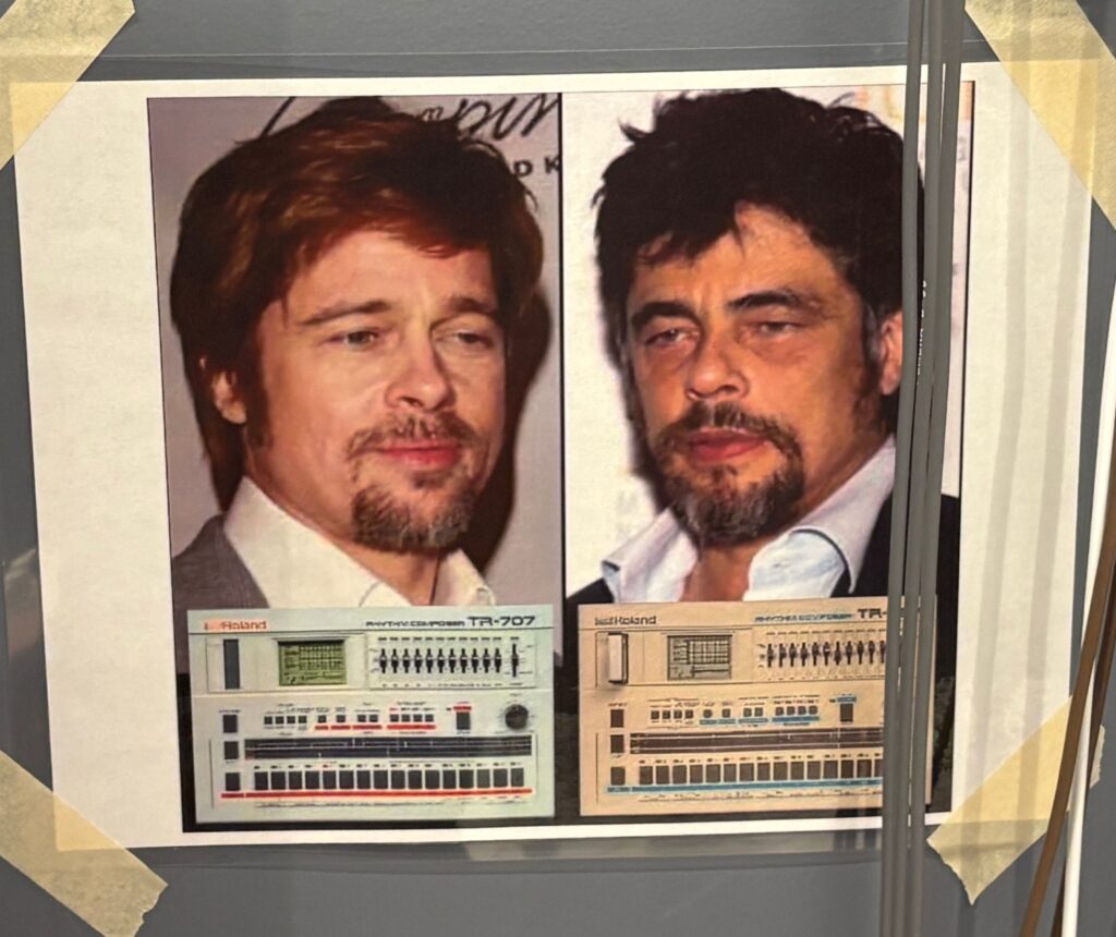 A photo taped to a wall shows two men’s portraits side by side above images of Roland drum machines. The left man is over a TR-707 and the right man is over a TR-727. Both men have similar facial hair and serious expressions.