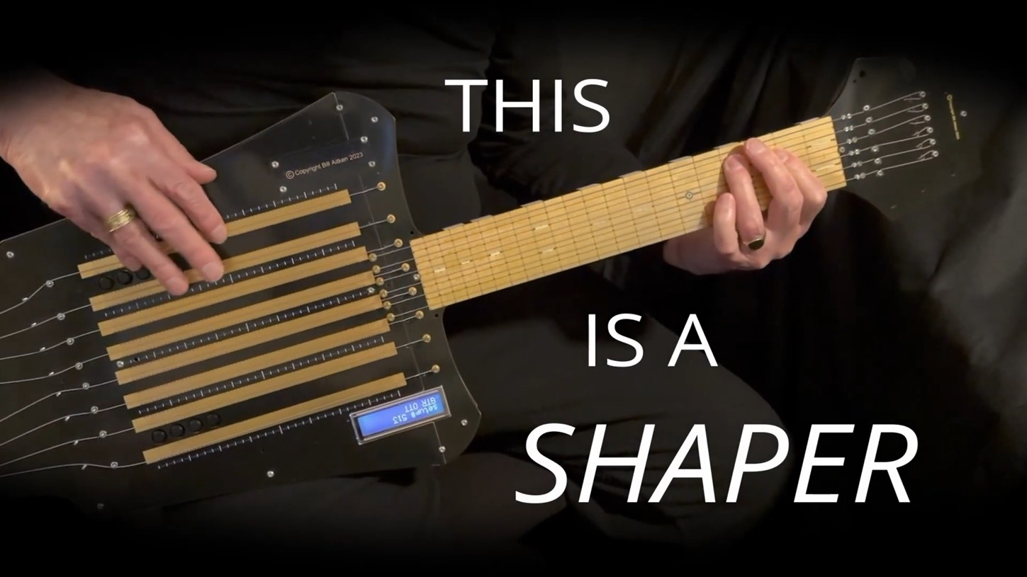 A person playing a modern electronic string instrument called a Shaper, with the text THIS IS A SHAPER overlaid on the image.